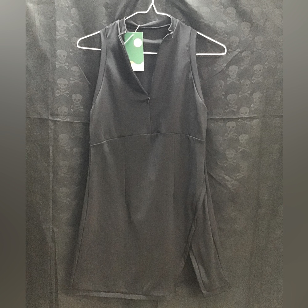 Small Black Halara Tennis dress. Come with shorts that have a pockets.